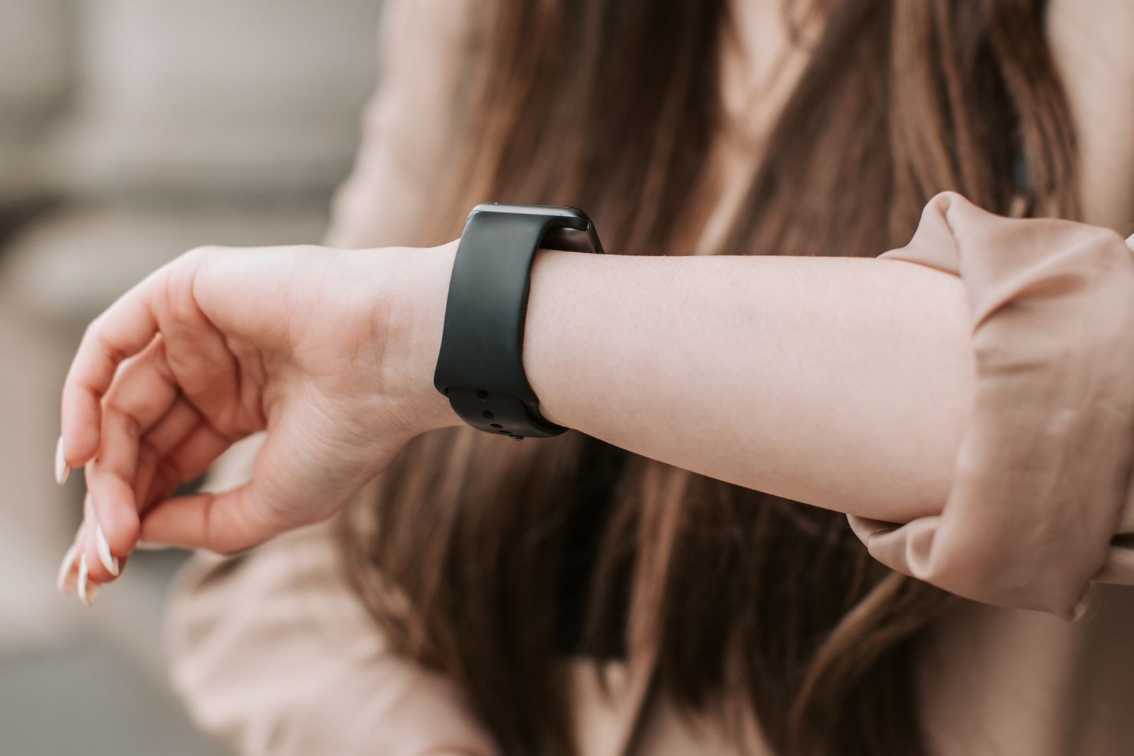 Woman checking her watch, the ADHD time blindness moment of realizing the hour vanished